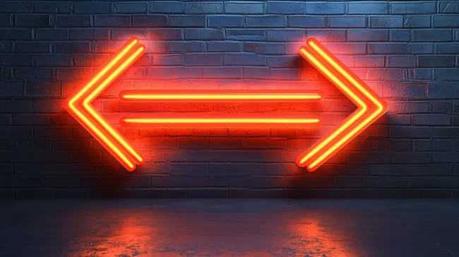 Kraftvolle, orangefarbene Neonpfeile an Backsteinwand