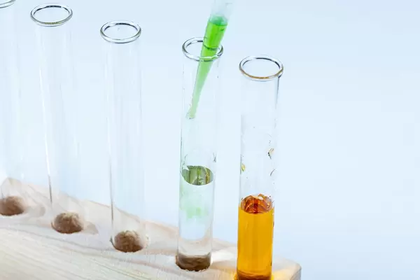 Laboratory test tubes in a wooden tripod (Flip 2020)