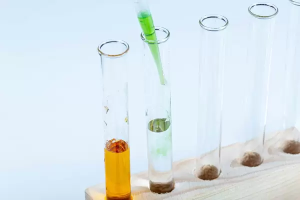 Laboratory test tubes in a wooden tripod