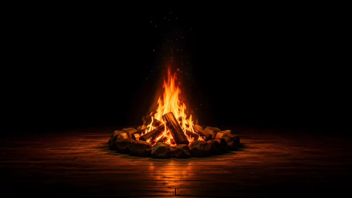 Lagerfeuer mit Steinring auf dunklem Holzboden