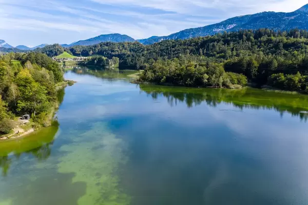 Landscape in the Austrian Alps in autumn: lake Reintal near Kramsach - village of lakes. Drone shot