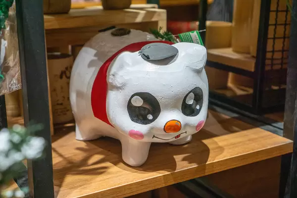 Large Decorative Piggy Bank for the Year of the Pig in Lunar Calendar for Sale in a Wooden Shelf