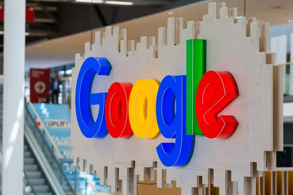 Large illuminated Google logo in a hall