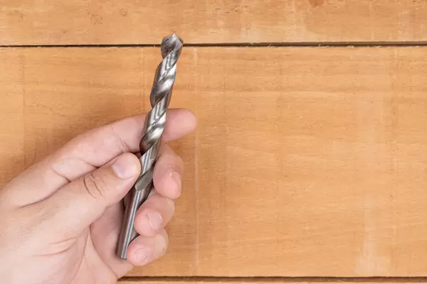 Large Metal Drill in the hand with copy space