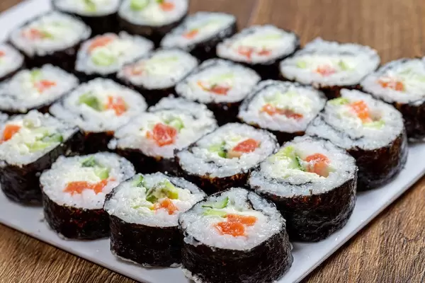 Large portion of Maki-rolls with salmon, avocado and cucumber (Flip 2019)