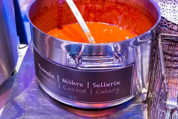 Large pot with a tomato-carrot-celery soup