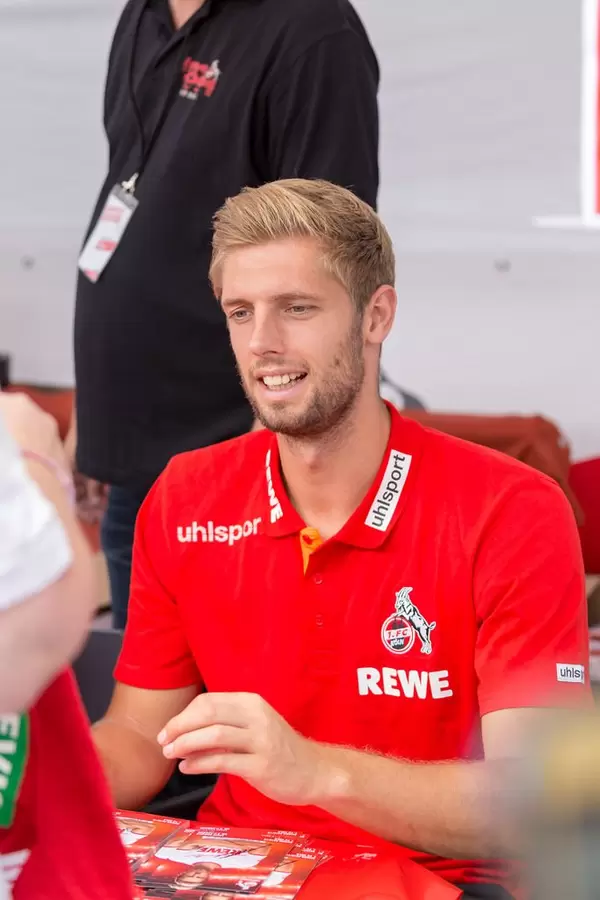 Lasse Sobiech signing autograph cards for fans