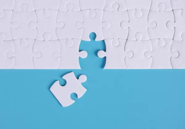 Last piece of jigsaw puzzle to complete the work or mission