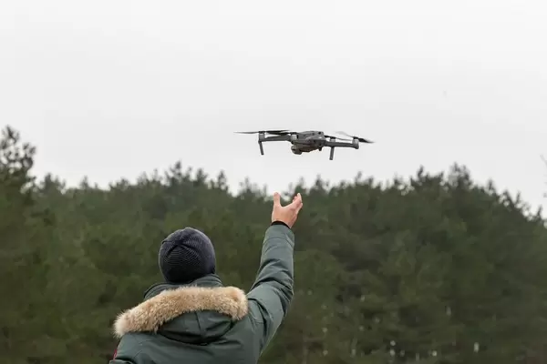 Launching drone takes off from the pilot's hand