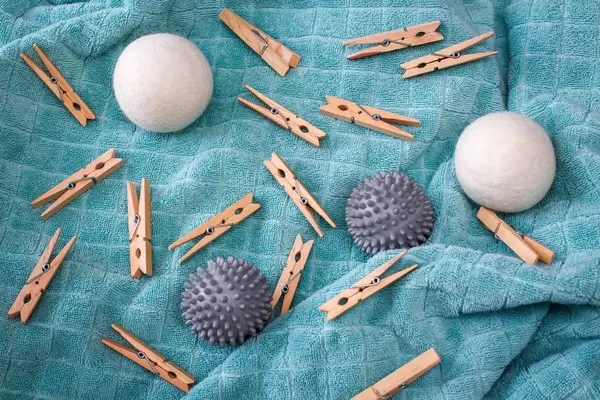 Laundry Clips and Drying Balls on a Towel