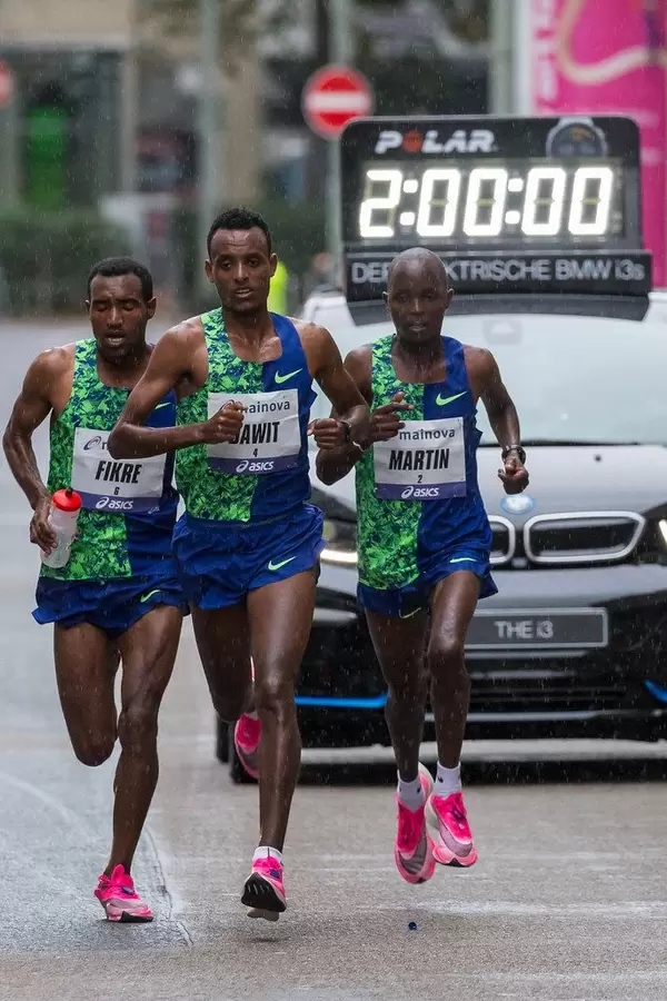 Leading Trio Dawit, Fikre and Martin at the two hour mark with the timing car in the background