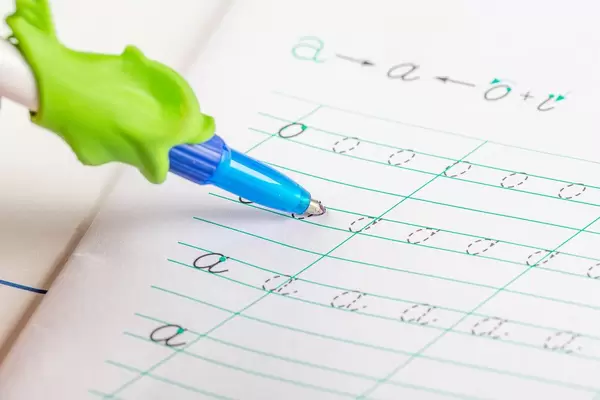 Learning to write abc in a children's notebook