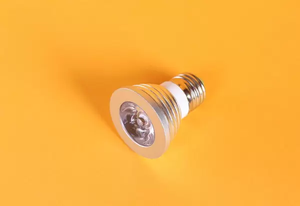Led bulb on orange background