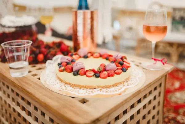 Lemon Cake With Berries And Wine On The Wooden Table