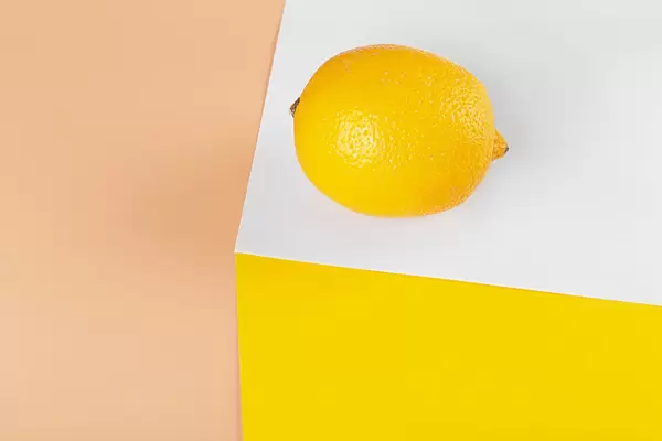 Lemon on white yellow and orange background