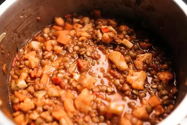 Lentil bolognese sauce with cauliflowers in saucepan