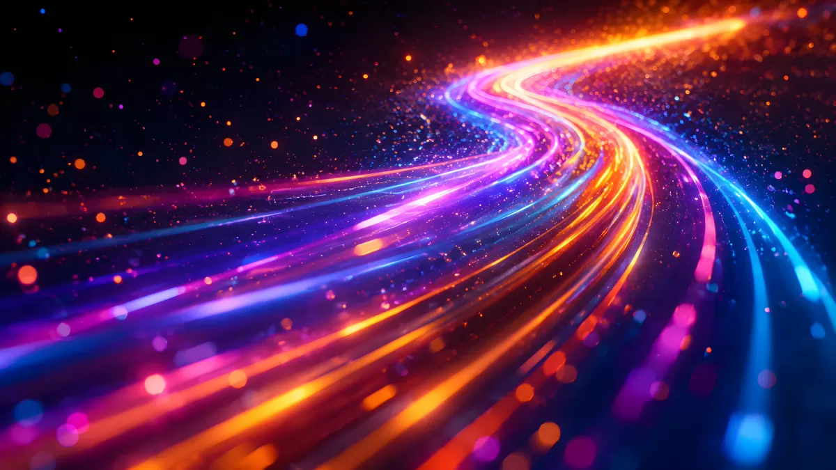 Leuchtende Lichtspuren in Neonfarben auf dunklem Hintergrund