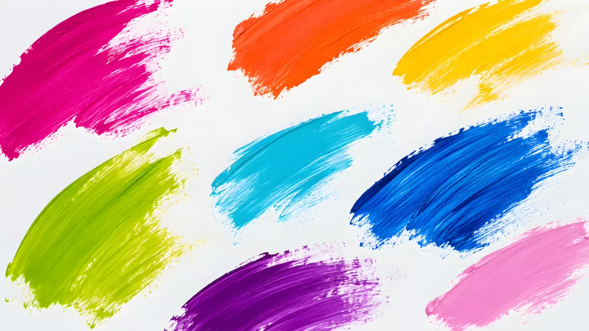 Leuchtende Pinselstriche in bunten Farben auf Weiß