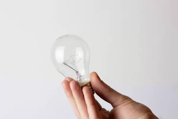 Light bulb in mans hand