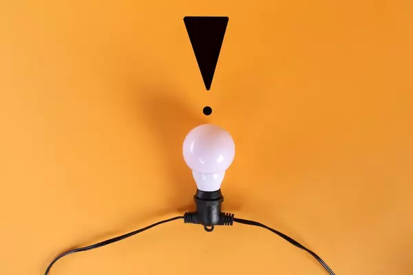Light bulb with exclamation mark