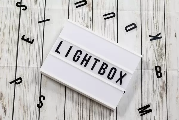 Lightbox on a table with typography letters