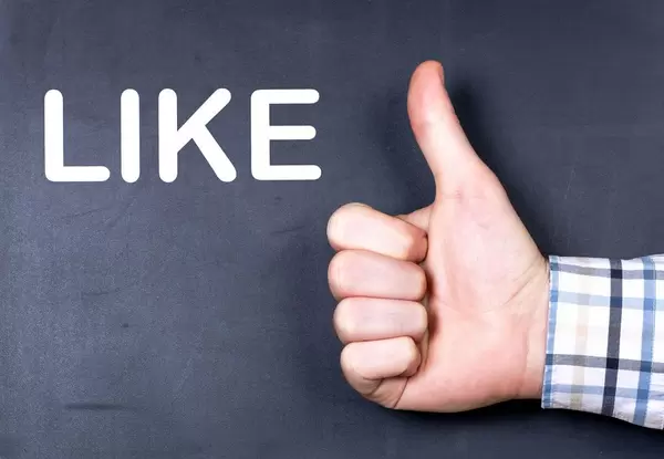 Like text with hand showing thumbs up