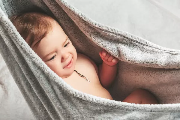 Little child in a gray plaid