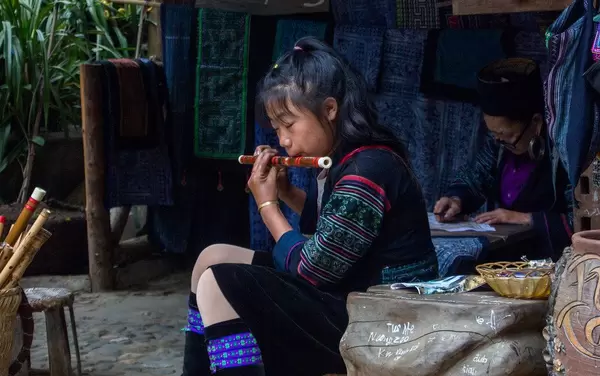 Little in Traditional Clothes playing flute