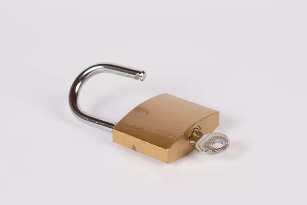 Lock and key on white background