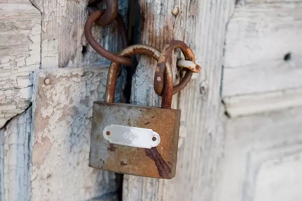 Lock the door with an old rusty safety lock