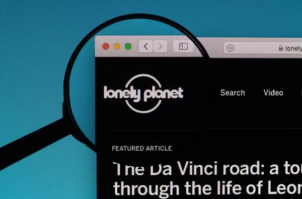 Lonely Planet logo under magnifying glass
