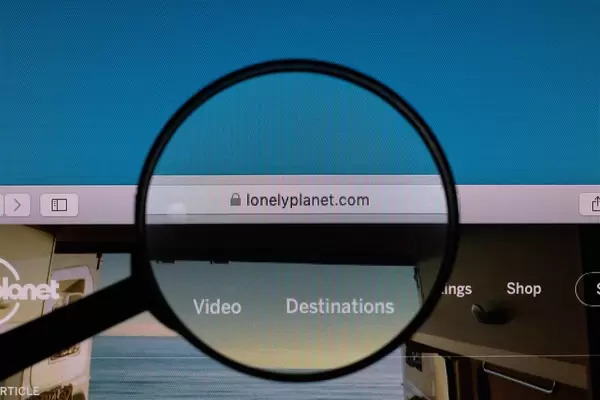 Lonely Planet website under magnifying glass
