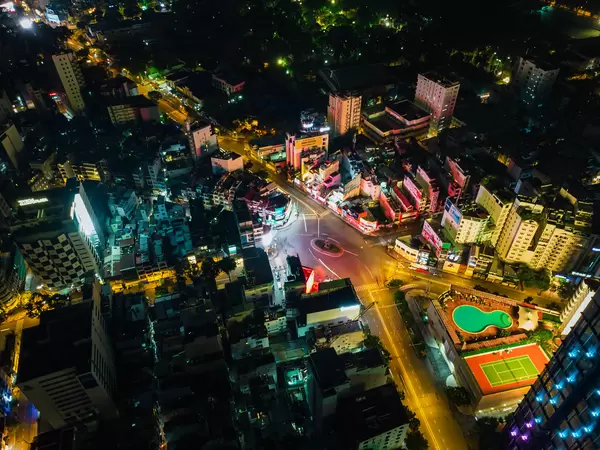 Long Exposure Drone Photo of Swimming Pool and Tennis Court next to Phu Dong Roundabout with Thanh Giong Monument in Ho Chi Minh City, Vietnam