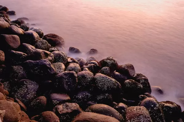 Long exposure of the sea wall during golden hour