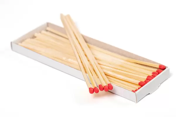 Long matches for fireplace on white