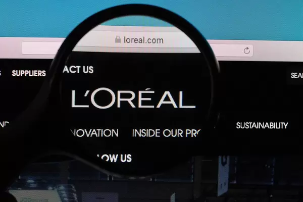 L'OREAL logo under magnifying glass