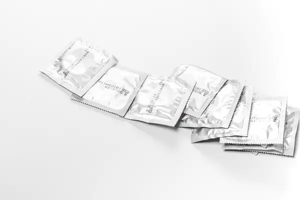 Lot of sealed condoms. The concept of contraception, the fight against AIDS (Flip 2019)