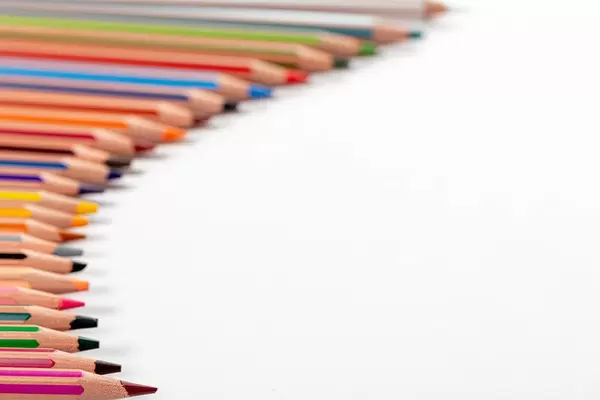 Lots of colorful pencils on white background with free space (Flip 2019)