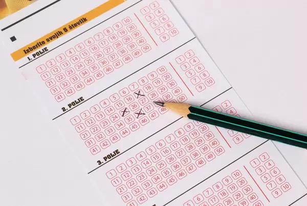 Lottery ticket and pencil