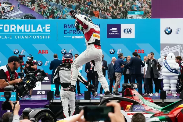 Lucas di Grassi's prepares to jump off the car after winning Berlin race