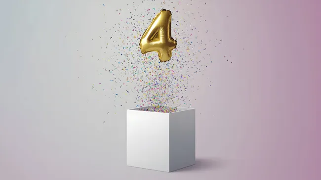 Luftballon-Zahl '4' mit buntem Konfetti über weißer Box