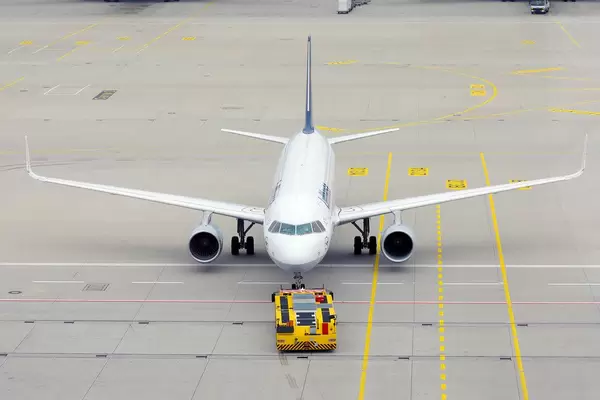 Lufthansa airplane being towed in Munich Airport, view from above