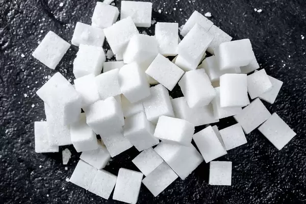 lump sugar cube on black background