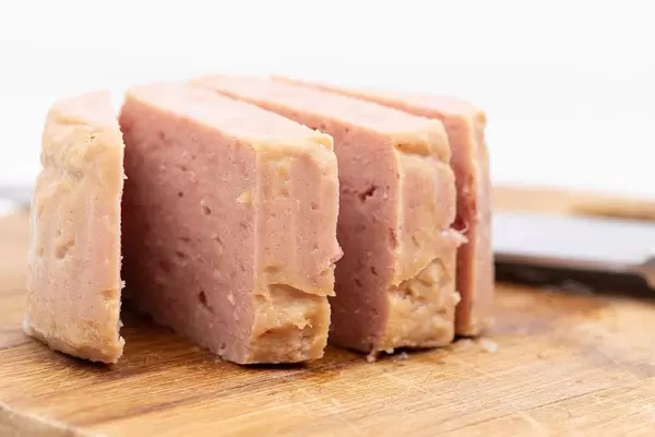 Luncheon Meat served on the wooden board