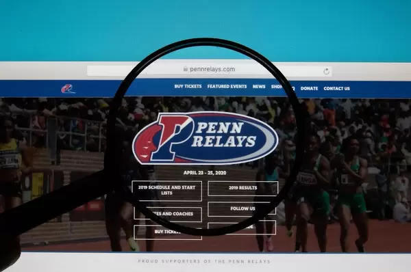 Lupe über dem Logo und Schriftzug der Penn Relays