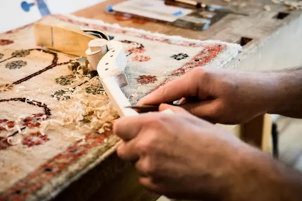 Luthier making a violin