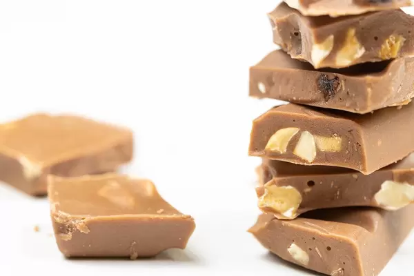 Macro of Chocolate bars stacked on the white table