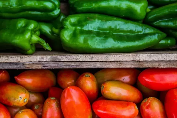 Macro of Crates with Tomatoes and Bell Peppers