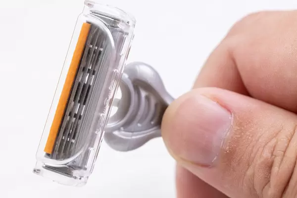 Macro of Plastic Razor in the hand