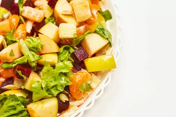 Macro shot of various fruits and vegetables mixed with honey